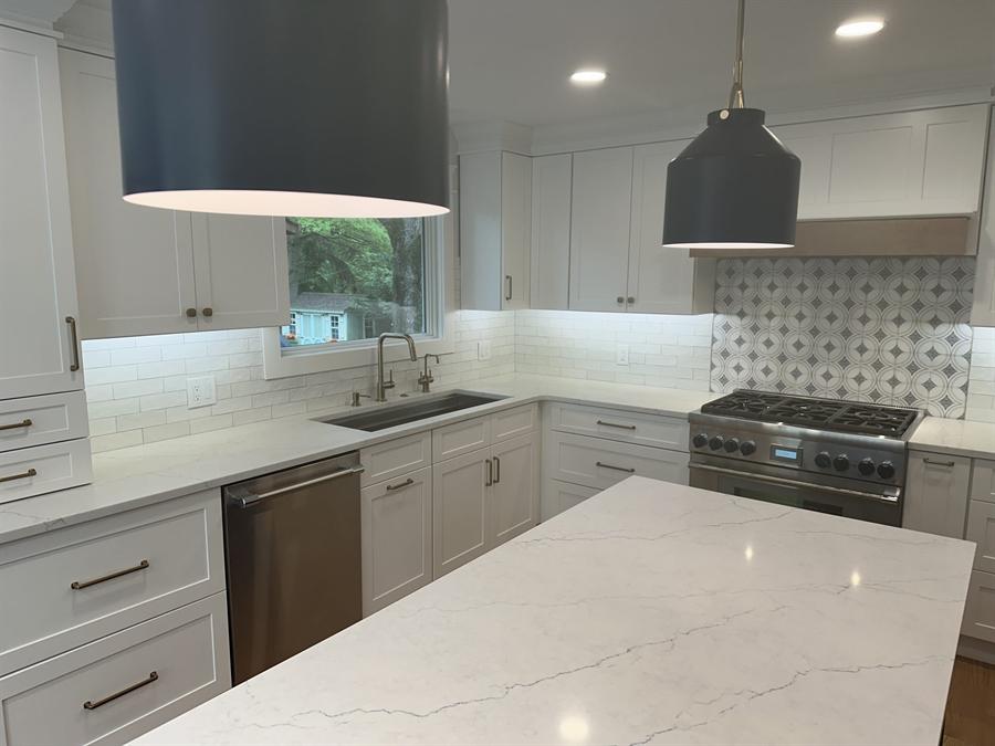 Kitchen with mosaic backsplash and waterfall porcelain countertop, New Jersey