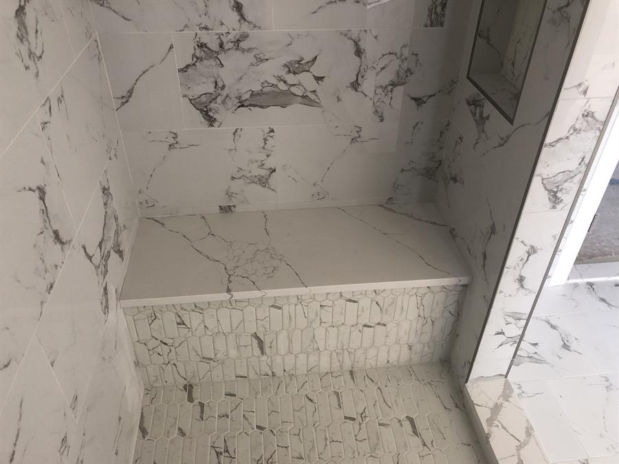 Porcelain shower with built-in bench and mosaic floor, New Jersey