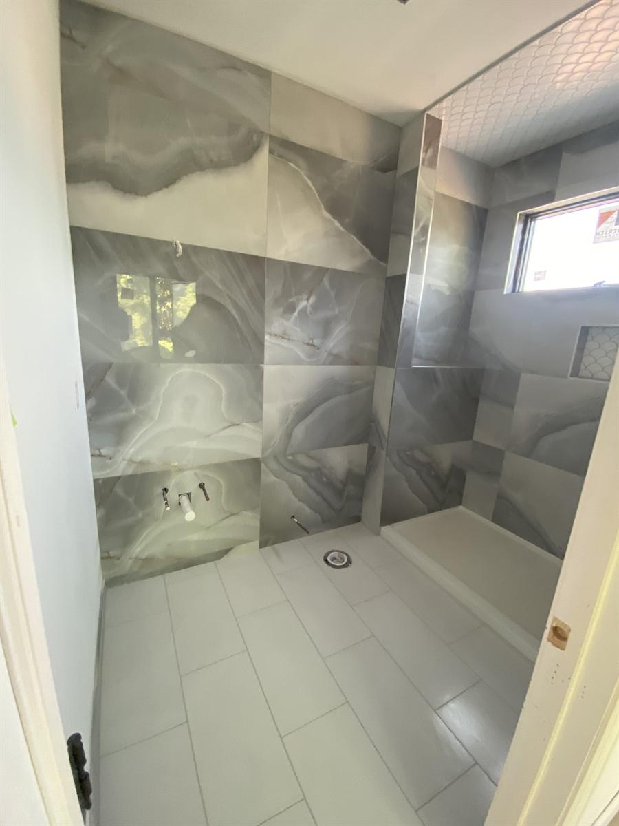 Porcelain shower walls with penny-round mosaic floor, New Jersey
